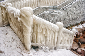 ice covered staircase on the beach