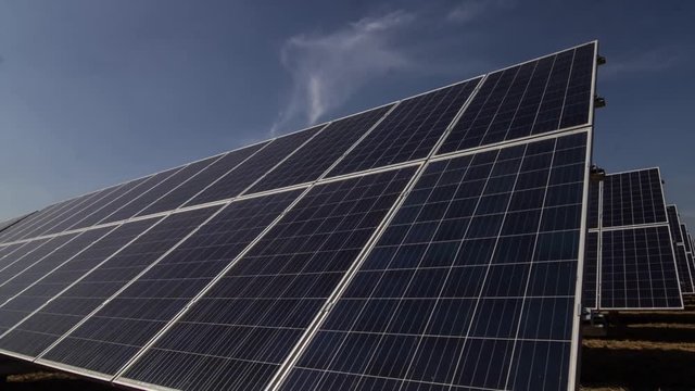 Solar panels tracking the sun, time lapse shot