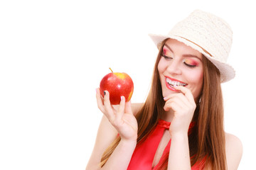 Woman summer hat colorful makeup holds apple fruit