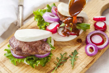 Gua bao, steamed sandwich, grilled pork bun with vegetables,pres