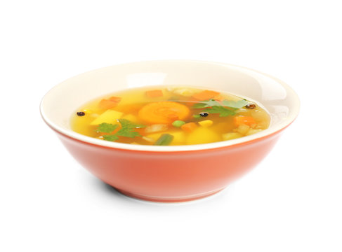 Fresh vegetable soup in plate on white background