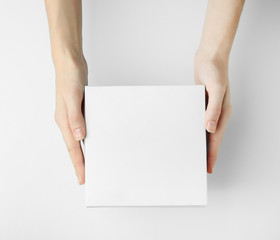 Female hands with box on white background