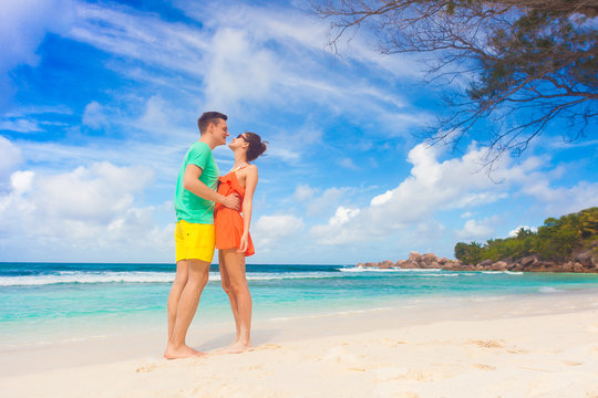 young couple relaxing at beach. Petit Anse, Seychelles