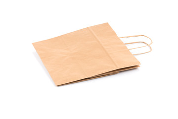Paper shopping bag on white