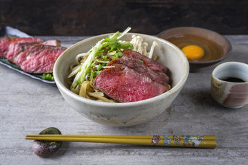 Traditional Japanese Ramen Soup with Wagyu Beef Filet as close-up in Bowl