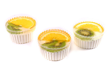 Three sweet desserts with a kiwi and lemon