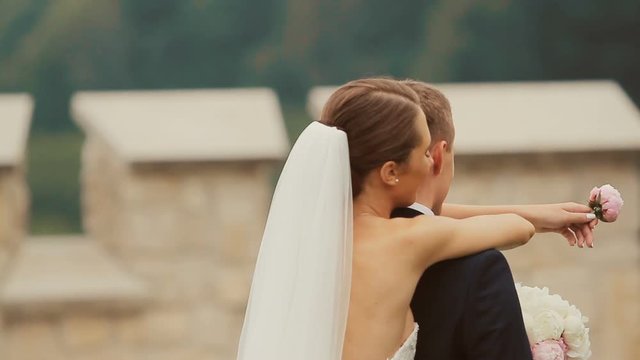 Beautiful young wedding couple, bride and groom first emotional meeting