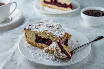 Delicious homemade pie with currants and coffee