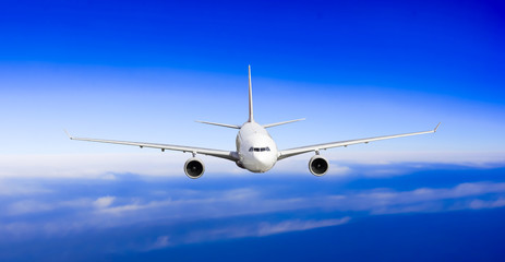 Fototapeta na wymiar airliner flying above clouds. Passenger airplane