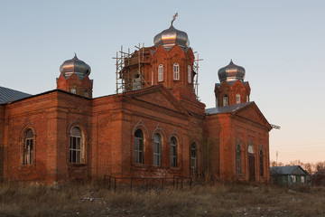 MIKHAYLOVKA VILLAGE, PENZA REGION, RUSSIA - OCTOBER 31, 2015: The restored Orthodox Life-giving Trinity Church at sunset. Built in 1871.
