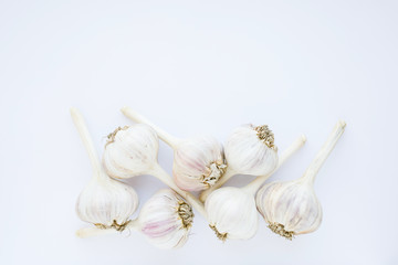 Group of garlic on a white table
