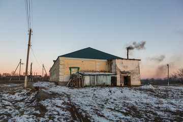 Fototapeta na wymiar Winter sunset in russian village. Mikhaylovka Village, Penza Region, Russia.