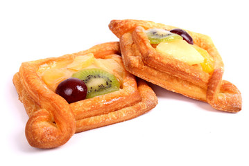 Sweet buns with a kiwi, pineapple and grapes