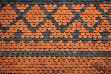 Textures and background depicting figures with red and black tiles