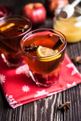 Tea with lemon and honey on wooden background