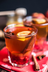 Tea with lemon and honey on wooden background