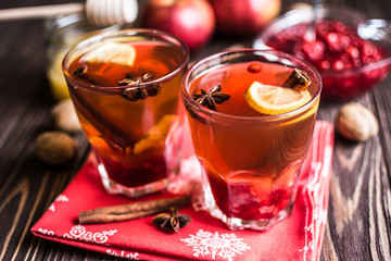 Tea with lemon and honey on wooden background