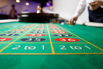 casino roulette tokens green table