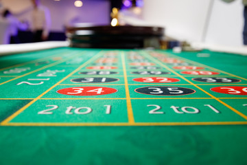 casino roulette tokens green table