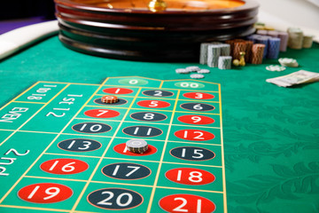casino roulette tokens green table
