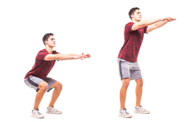 Sit Squats. Young man doing sport exercise.