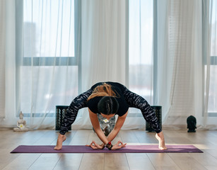 Yoga trainer executing asana