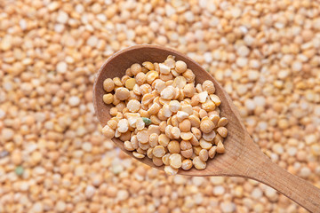 yellow peas in a spoon