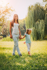 Fototapeta premium Cute Little Girl And Her Mom