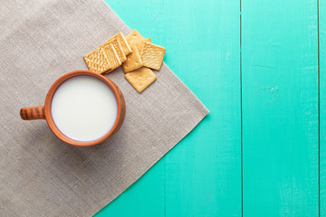 healthy breakfast cup of milk and crackers, close up, top vew