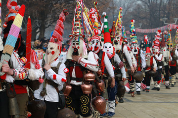 PERNIK, BULGARIA - JANUARY 29, 2017 - Masquerade festival Surva in Pernik, Bulgaria. People with mask called Kukeri dance and perform to scare the evil spirits