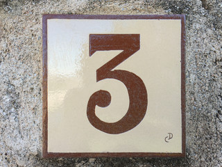 Ceramic tile with numer three 3