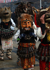 Obraz premium PERNIK, BULGARIA - JANUARY 29, 2017 - Masquerade festival Surva in Pernik, Bulgaria. People with mask called Kukeri dance and perform to scare the evil spirits