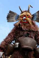 PERNIK, BULGARIA - JANUARY 29, 2017 - Masquerade festival Surva in Pernik, Bulgaria. People with mask called Kukeri dance and perform to scare the evil spirits