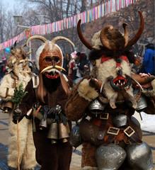 Obraz premium PERNIK, BULGARIA - JANUARY 29, 2017 - Masquerade festival Surva in Pernik, Bulgaria. People with mask called Kukeri dance and perform to scare the evil spirits