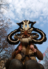 Fototapeta na wymiar PERNIK, BULGARIA - JANUARY 29, 2017 - Masquerade festival Surva in Pernik, Bulgaria. People with mask called Kukeri dance and perform to scare the evil spirits