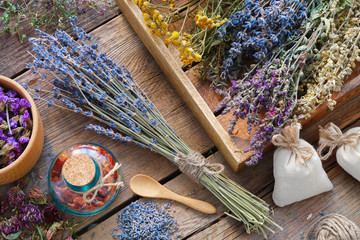 Bunch of lavender and medicinal herbs, mortar of dry healthy flowers