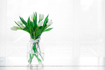 Bouquet of white tulips in a vase
