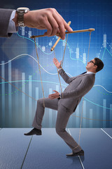 Businessman puppet being manipulated by boss