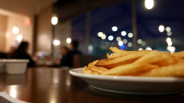 Motion of people ordering foods inside Denny's restaurant