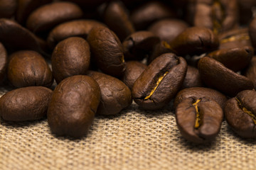 Coffee beans on vintage linen background