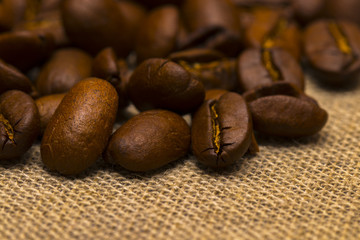 Coffee beans on vintage linen background