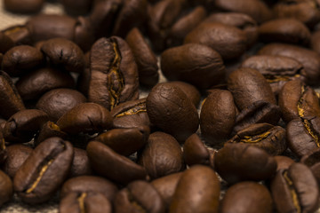 Coffee beans on vintage linen background