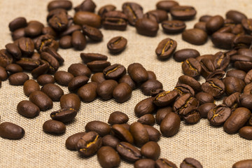 Coffee beans on vintage linen background
