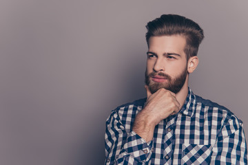 Fototapeta premium Young handsome thoughtful businessman isolated on gray backgroun
