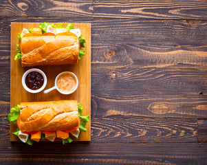 Delicious and Tasty sandwiches with turkey, ham, cheese, tomatoe