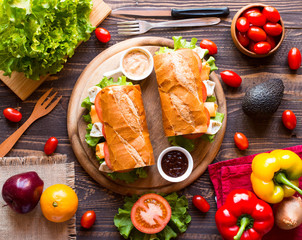 Delicious and Tasty sandwiches with turkey, ham, cheese, tomatoe