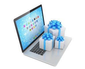 Gift box with ribbon bow on laptop keyboard. 3d rendering.