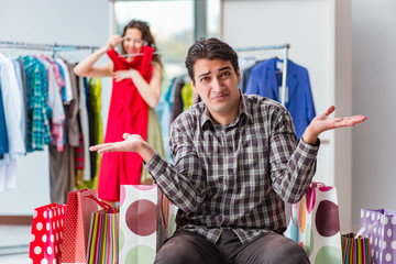 Man waiting for his wife during christmas shopping