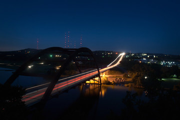 A timelapse view of an Austin Texas landmark, the 360 Pennybacker Bridge, at night.