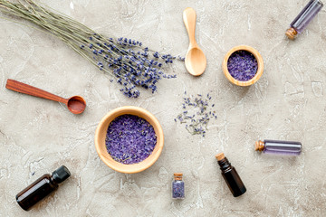 Essential oil and lavender salt with flowers top view